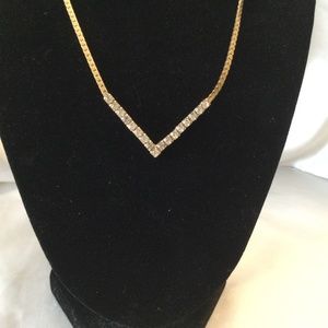 Formal Gold tone Necklace V shaped with cubic zirconia gems